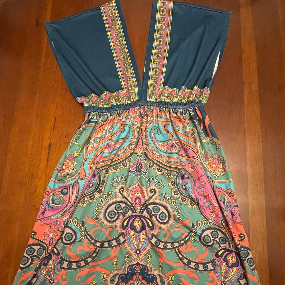Dress with beautiful colors and V neck in front and back.